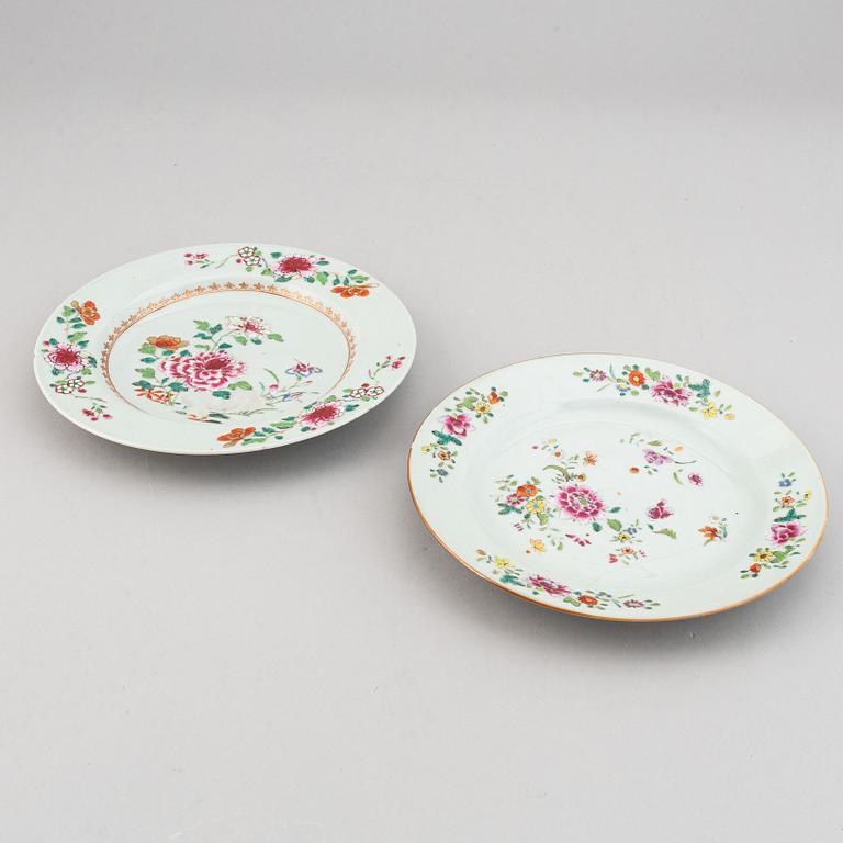 A set of two blue and white serving dishes, and two famille rose dinner plates, Qing dynasty, Qianlong (1736-95).