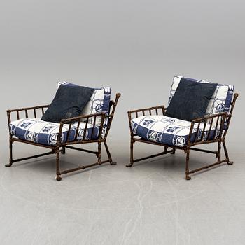 A Pair of contemporary garden easy chairs in metal imitating bamboo.