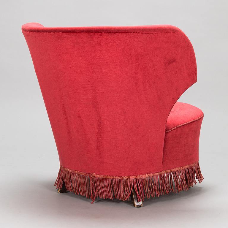 A mid-20th -century sofa and armchair.