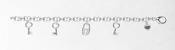 666. ARMBAND, Chopard, fem berlocker i form av hjärta, nycklar och hänglås.