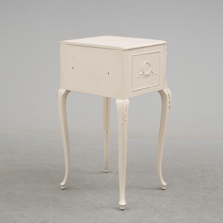 A 20th century rococo style bedside table.