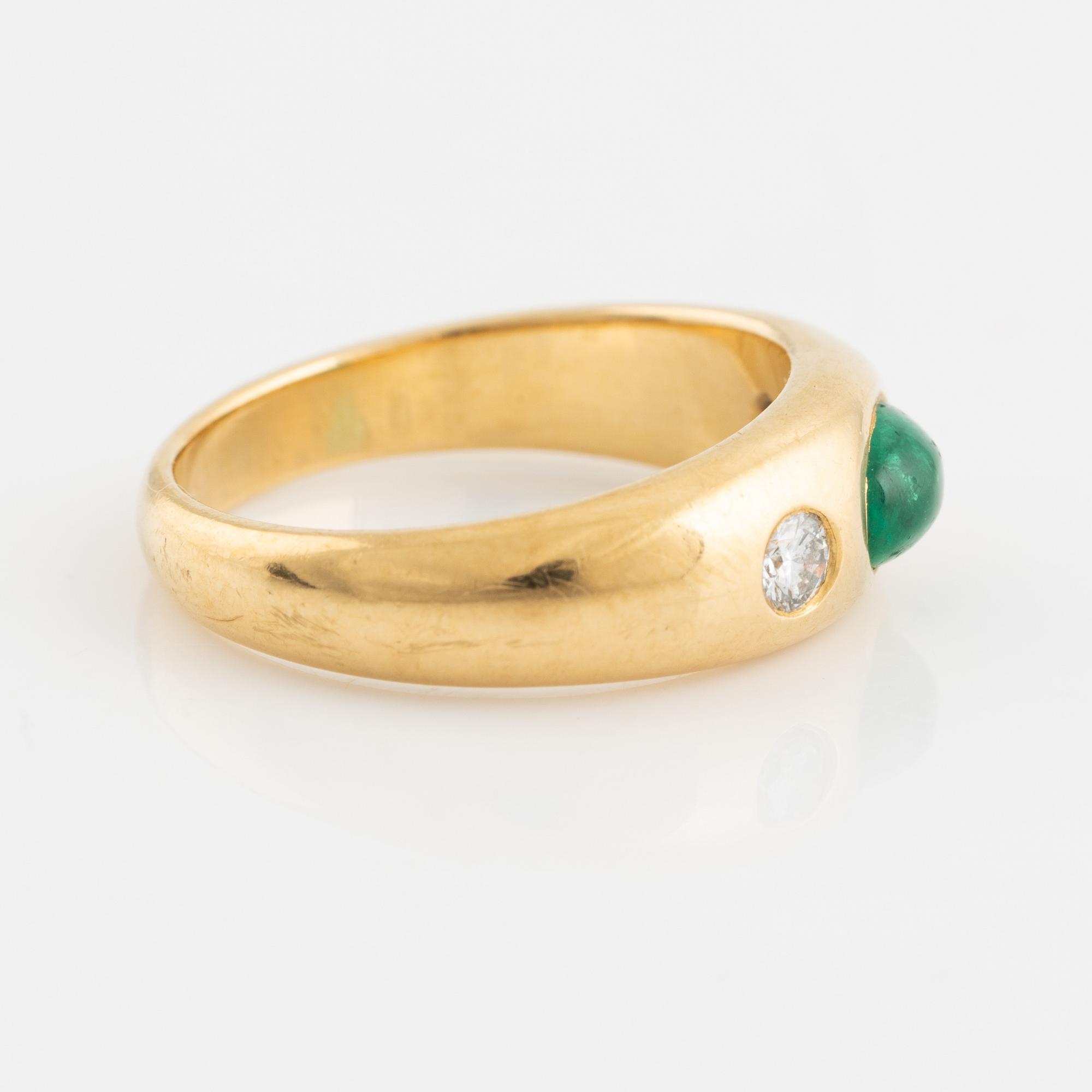 Cabochon cut emerald and brilliant cut diamond ring.