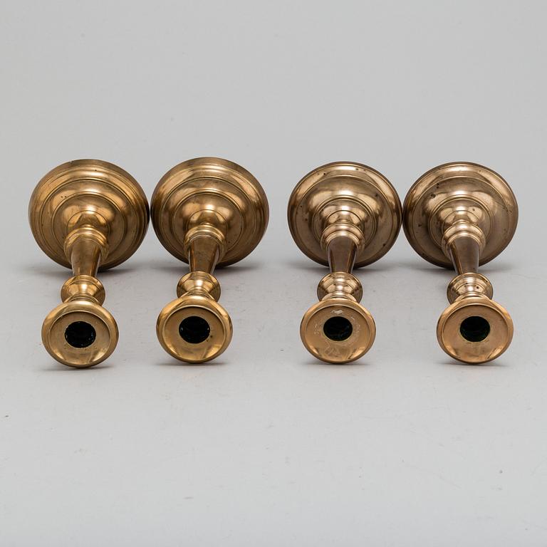 Four (2+2) brass candle holders, including Skultuna.