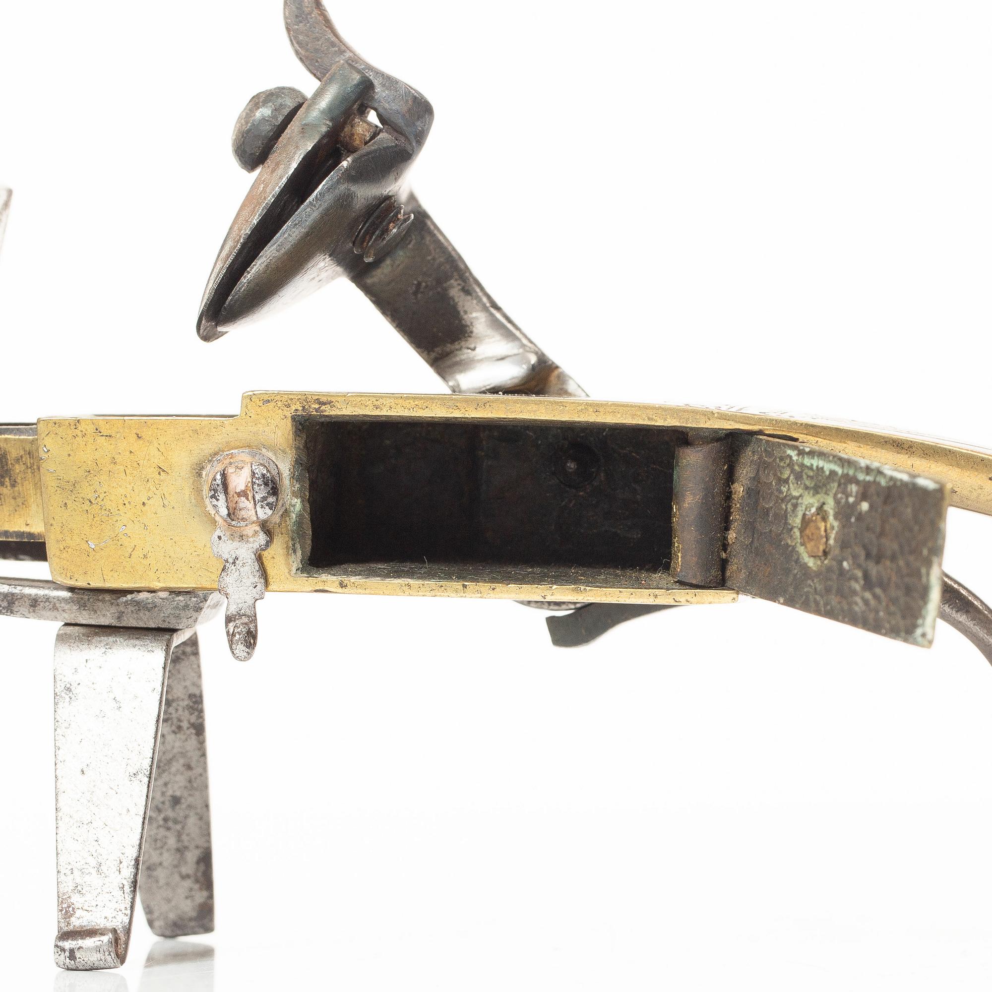 A Northern European flintlock lighter, mid 18th century.