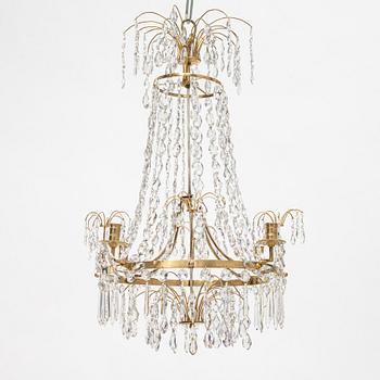 A Gustavian four-branch gilt-brass chandelier, Stockholm, late 18th century.