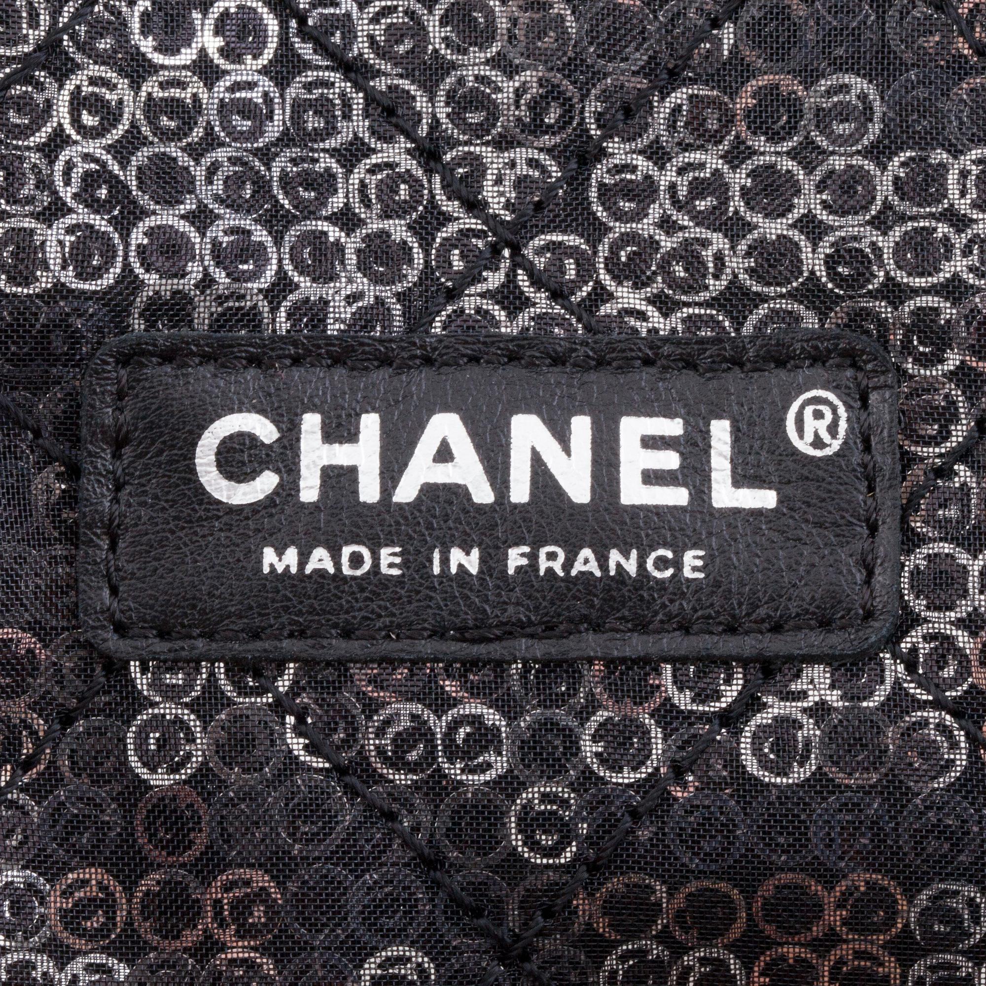 CHANEL, a black and silver tinsel evening "Flap-bag".