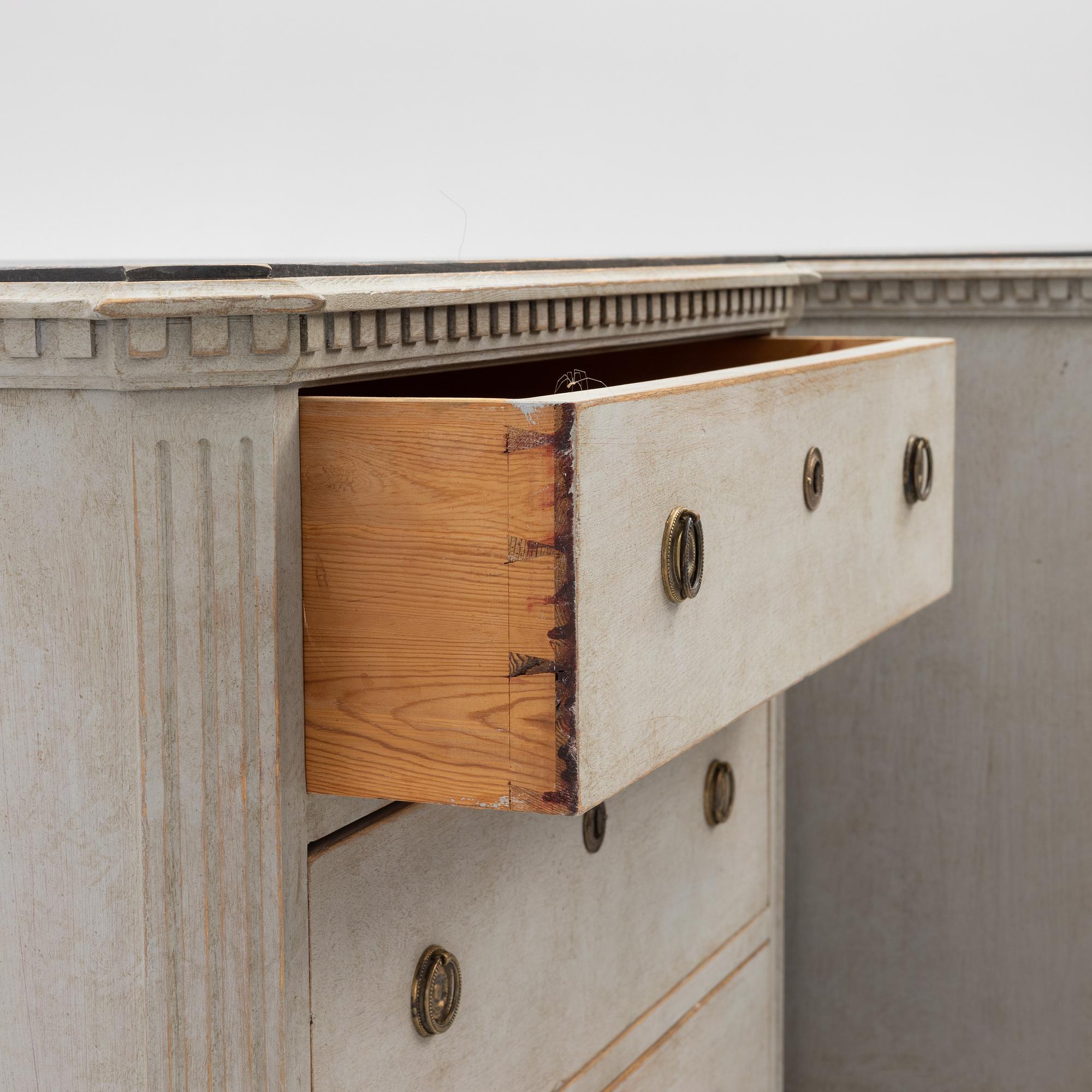 A pair of Gustavian style chests of drawers, early 20th century.