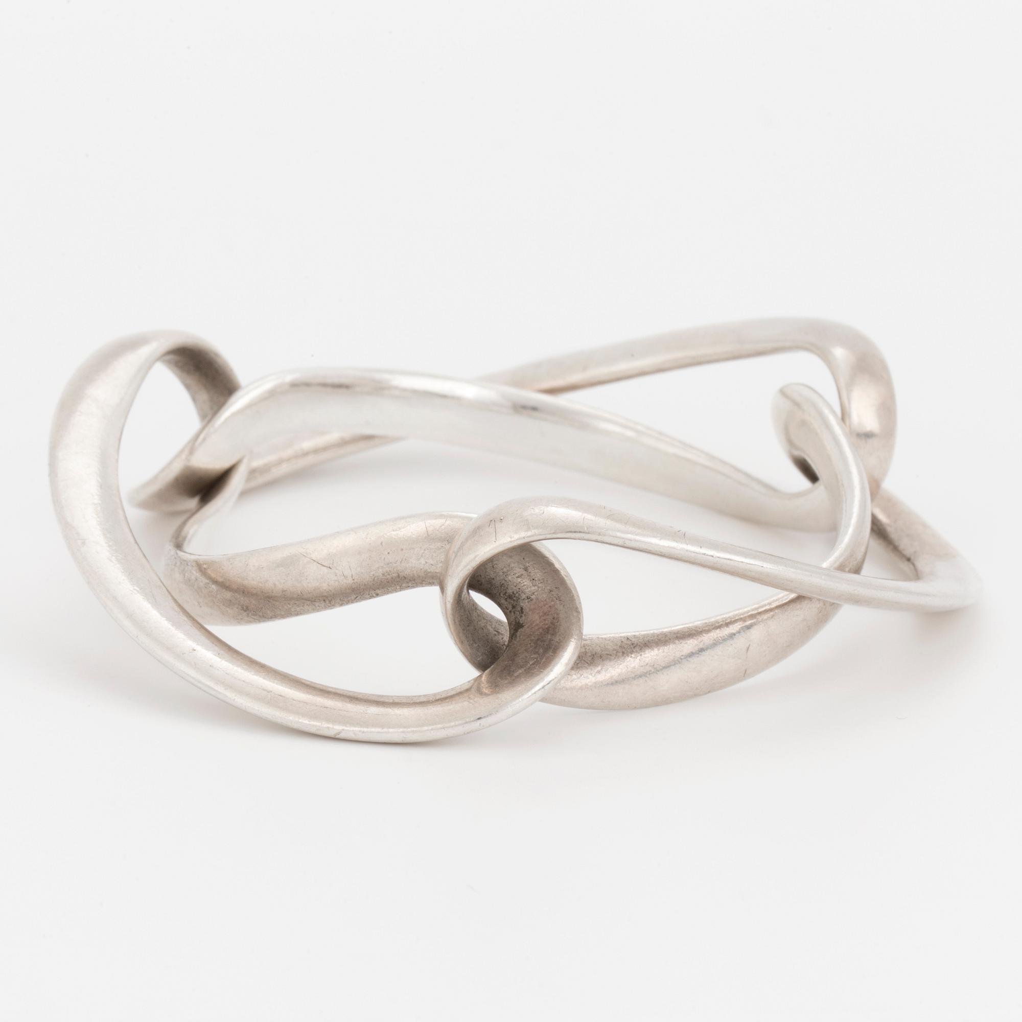 An 'Infinity' silver bracelet by Georg Jensen.
