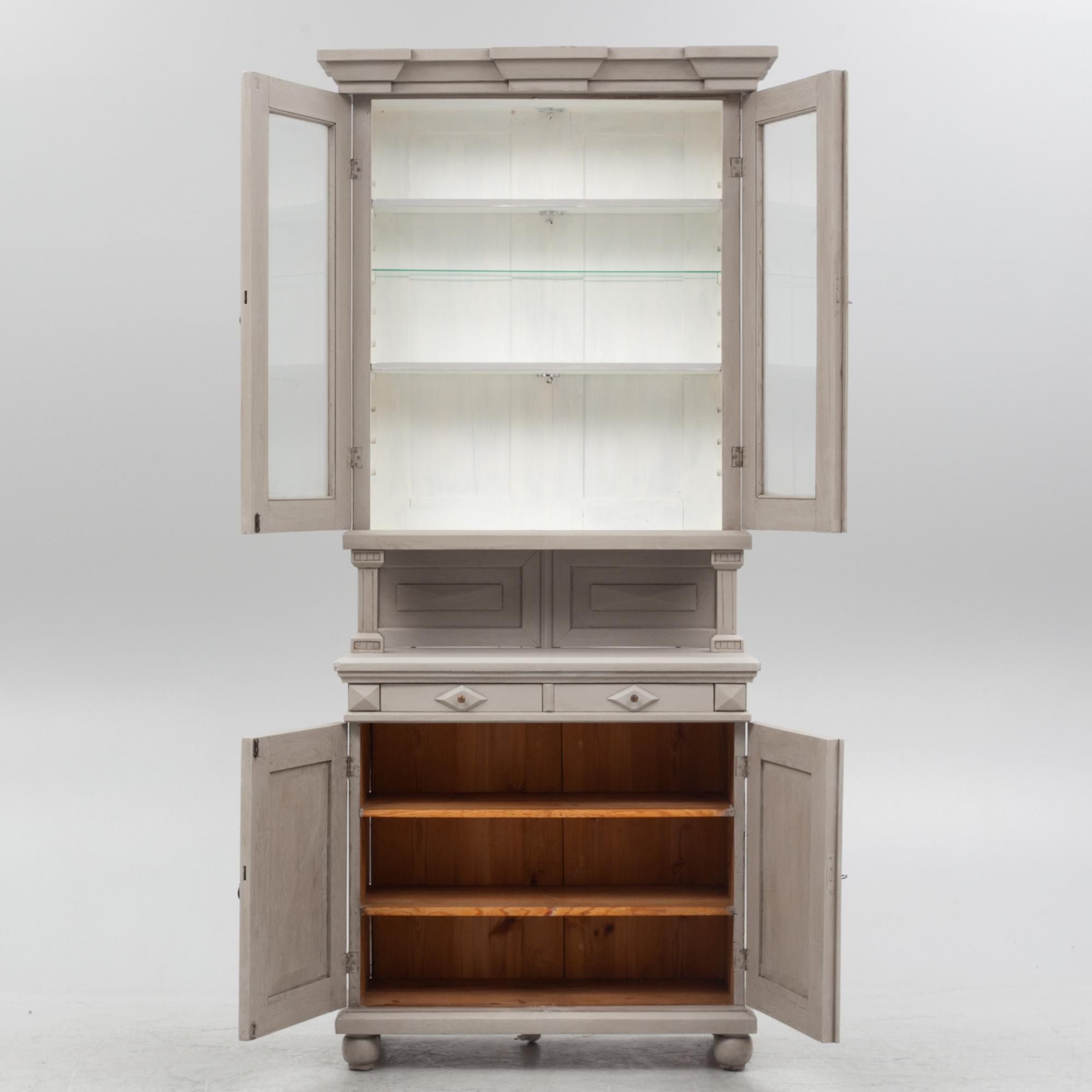 A two-part cabinet, around 1900.