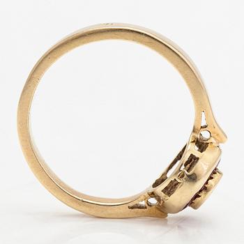 Ring, 14K guld med en diamant ca 0.23 ct och rubiner.