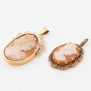 Two gold and shell cameo pendants.