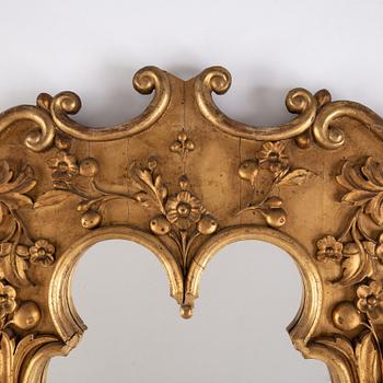A late 19th century bronzed mirror.
