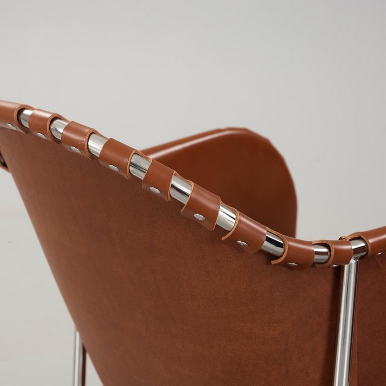 Mats Theselius, A pair of 'Bruno' brown leather and steel easy chairs, Källemo, Sweden.