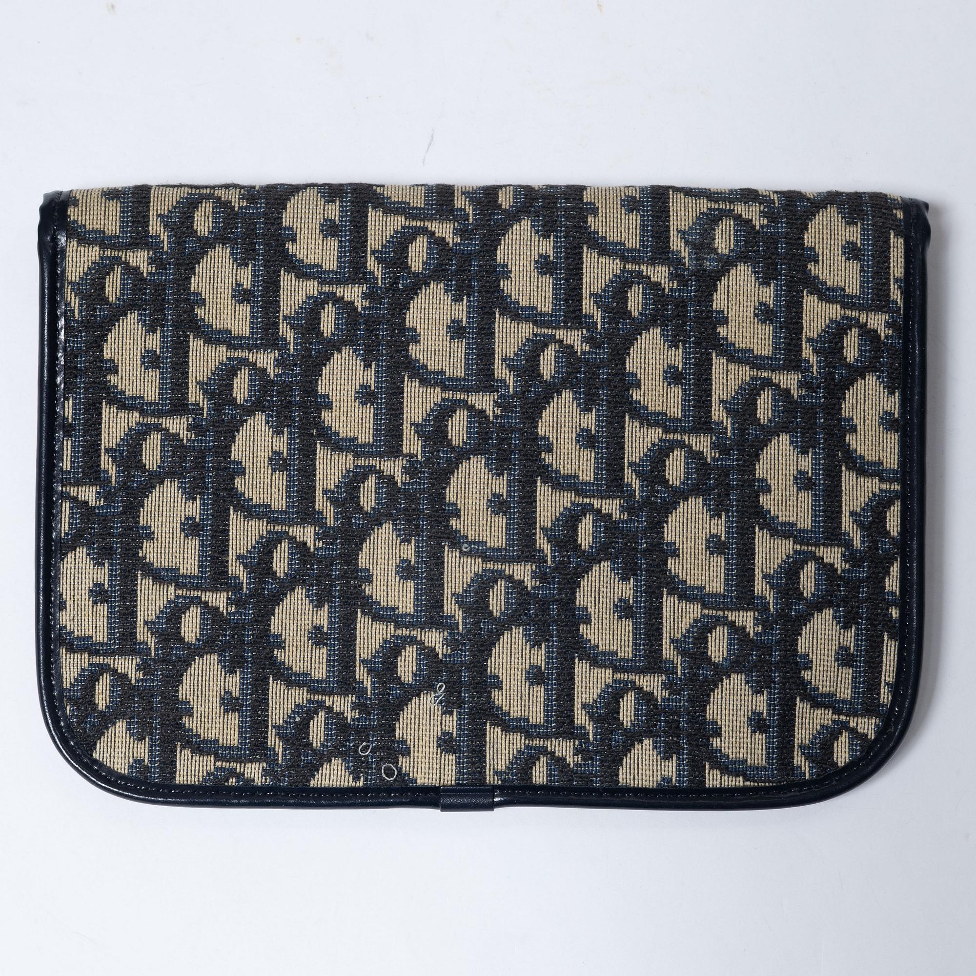 Christian Dior, a clutch and a scarf.