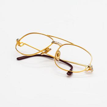 must de Cartier, Santos, a pair of eyeglass frames. Marked Cartier, Paris, Made in France 135, 56, 16.