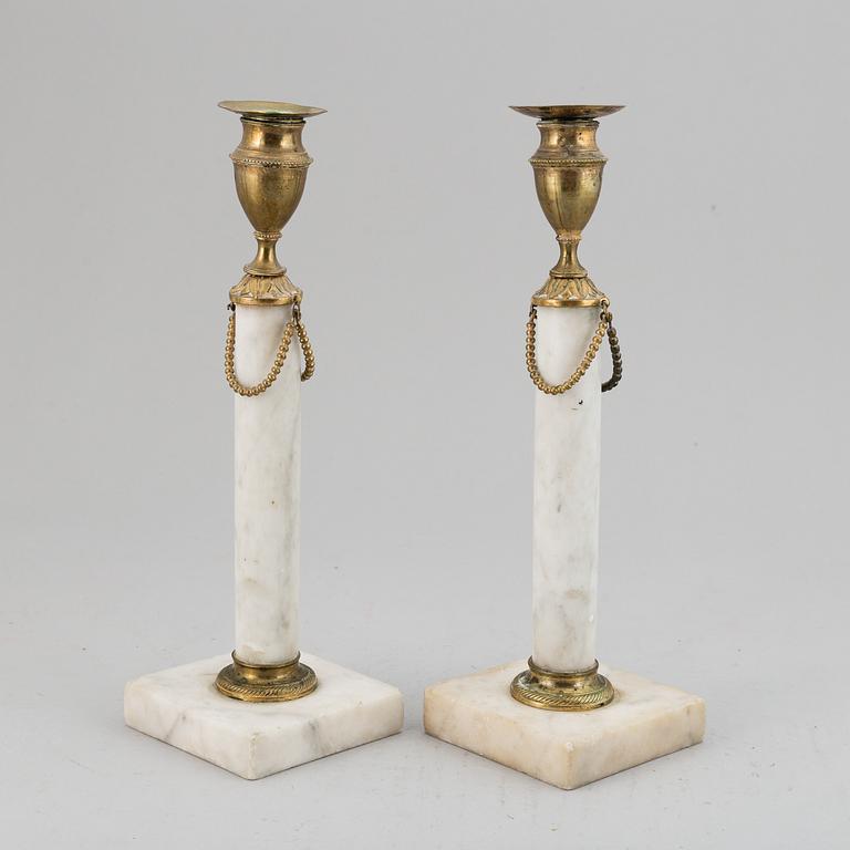 A pair of late Gustavian candle sticks.