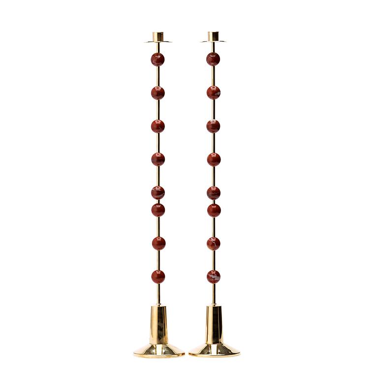 Sigurd Persson, A pair of brass and red jasper candlesticks, Uno Berg AB, Sweden.