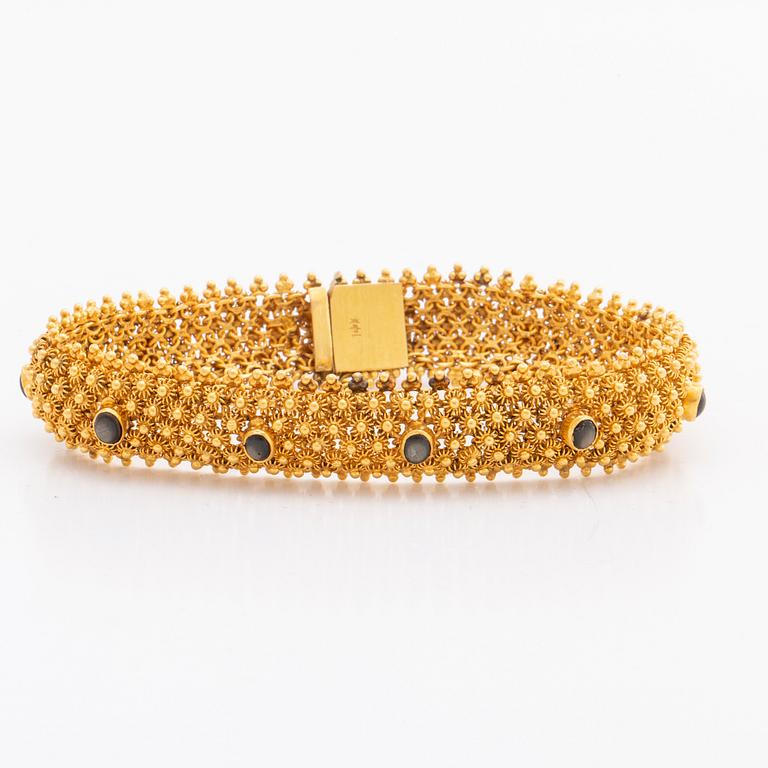 ARMBAND 14K guld, 35,1 g. bruna cabochonslipade stenar, ca 19 x 1,5 cm.