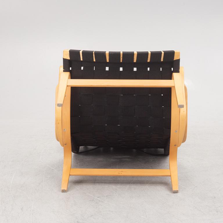 Bruno Mathsson, a "Pernilla" armchairs with ottoman, Dux, Sweden, second half of the 20th century.