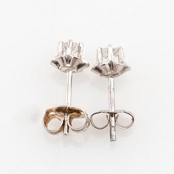 Earrings, a pair of 18K white gold set with round brilliant-cut diamonds.