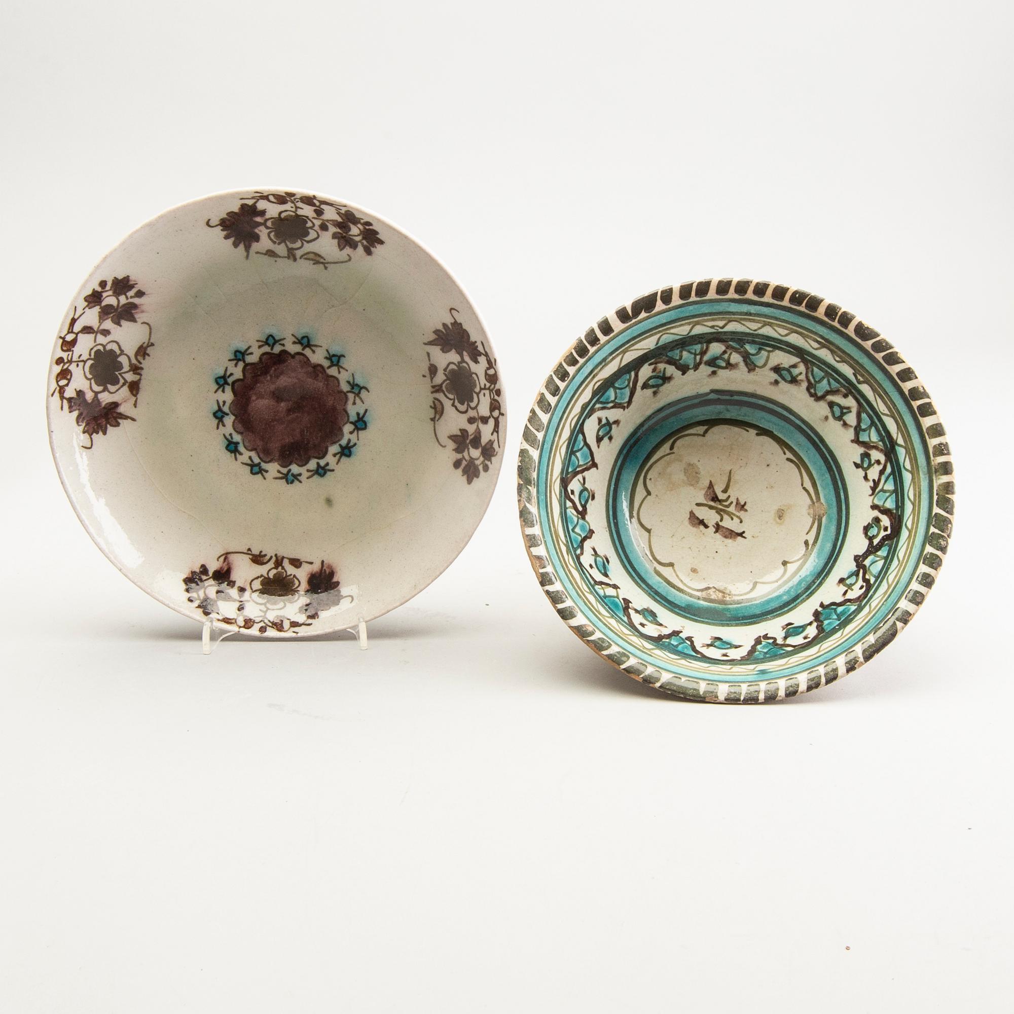A group of four persian ceramics, 17th/19th Century.