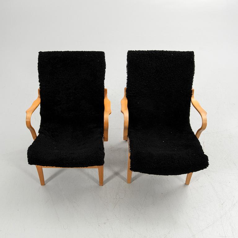 Bruno Mathsson, armchairs, a pair, "Eva", Bruno Mathsson International, Värnamo, second half of the 20th century.