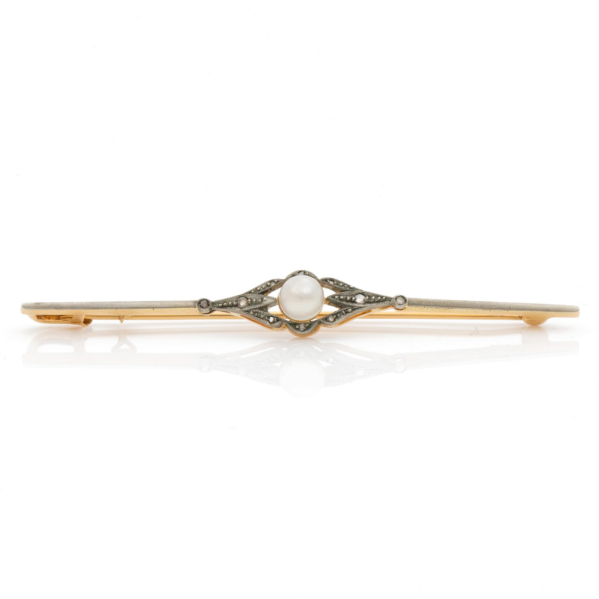 A bar brooch set with a cultured pearl and diamonds.