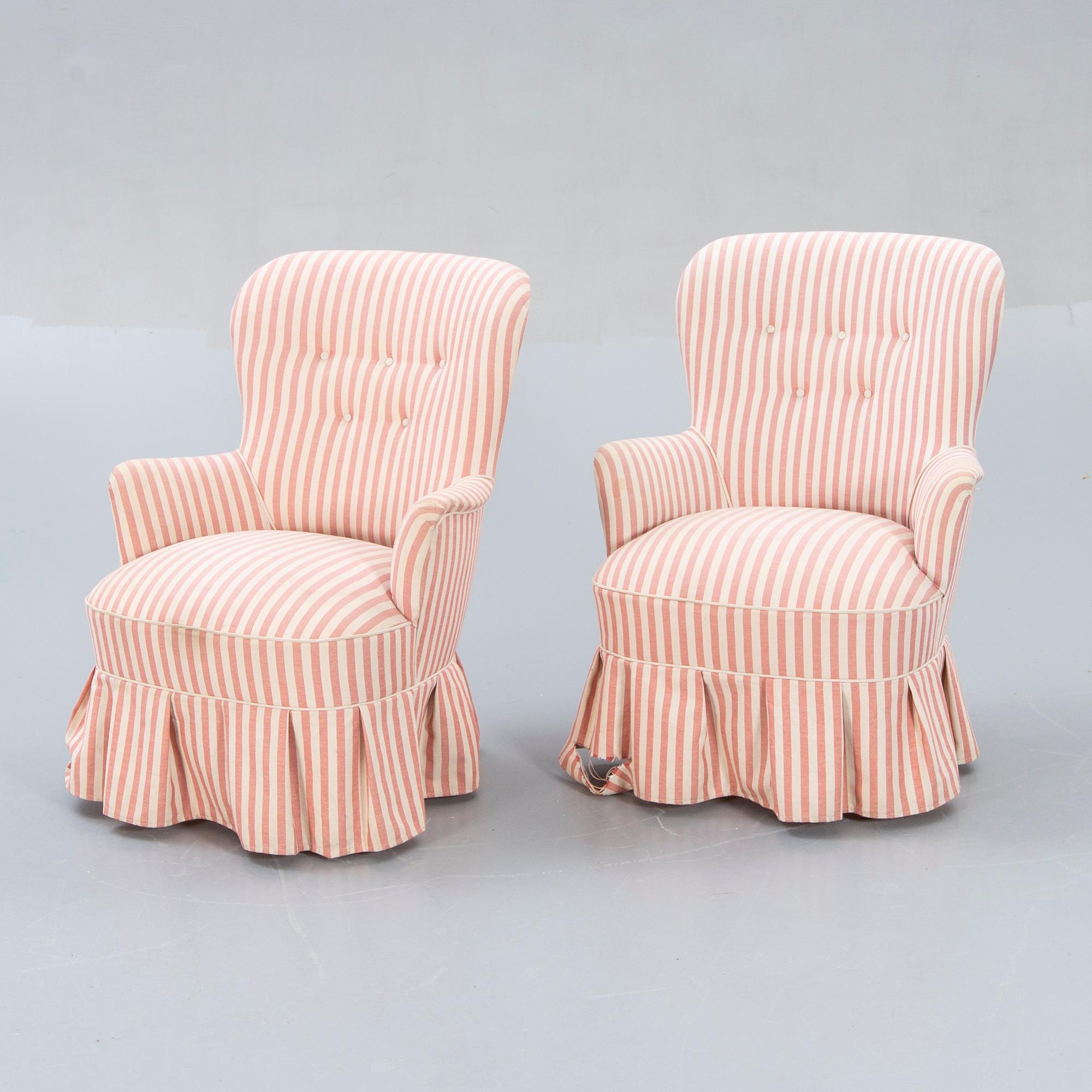 A pair of Modern easy chairs.