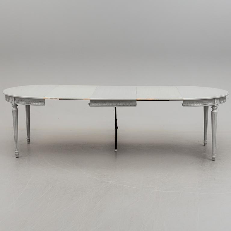 A Gustavian style dining table and ten chairs, 20th century.