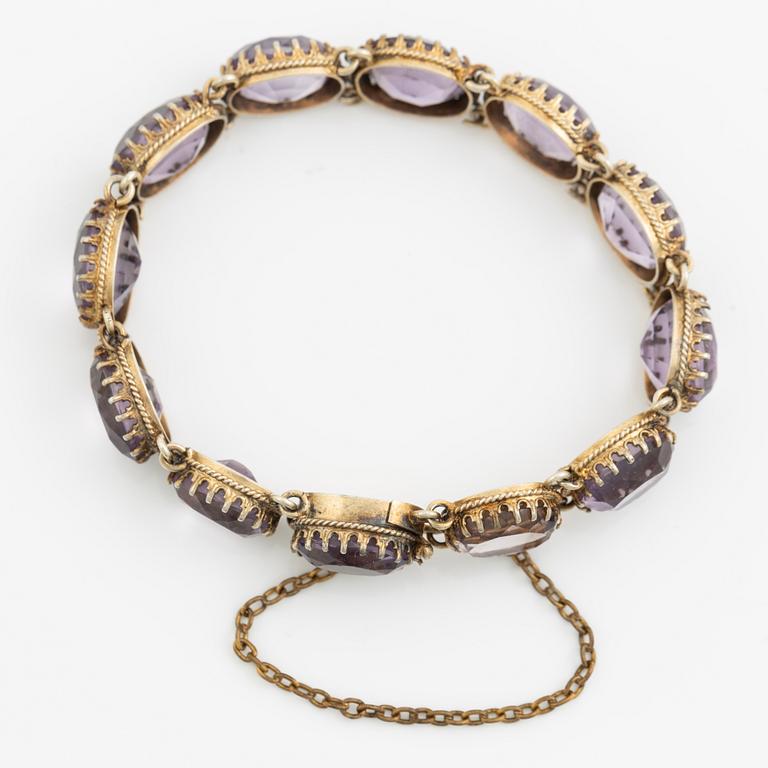 Garniture, necklace and bracelet silver with amethysts, brooch gold-coloured metal with purple paste stones,