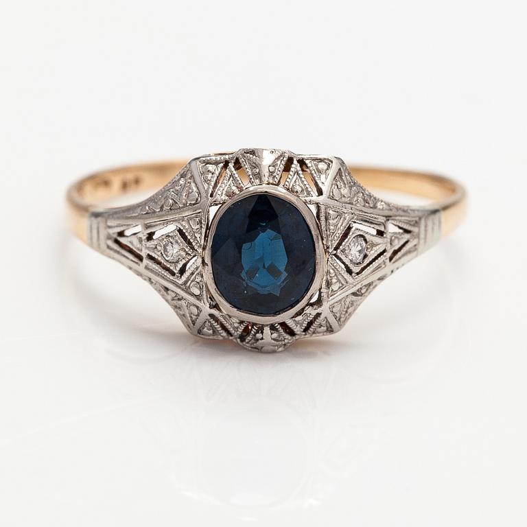 A 14K gold ring with diamonds ca. 0.02 ct in total and a sapphire. Finnish import marks.