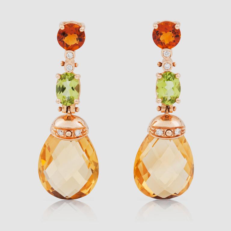 A pair of citrine and peridot earrings.