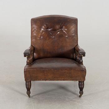 A LEATHER ARMCHAIR early 20th century.