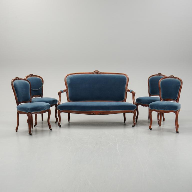 A sofa and a set of four chairs, Rococo revival, late 19th century.