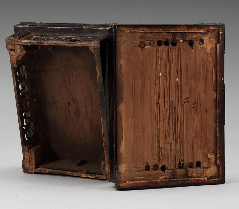 A lacquered wooden Japanese deity on a stand, 19th Century.