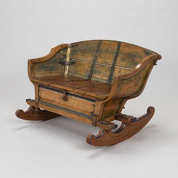 A 19th-century wooden sleigh.