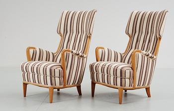 A pair of Nordiska Kompaniet armchairs, probably by Elias Svedberg, 1940's-50's.