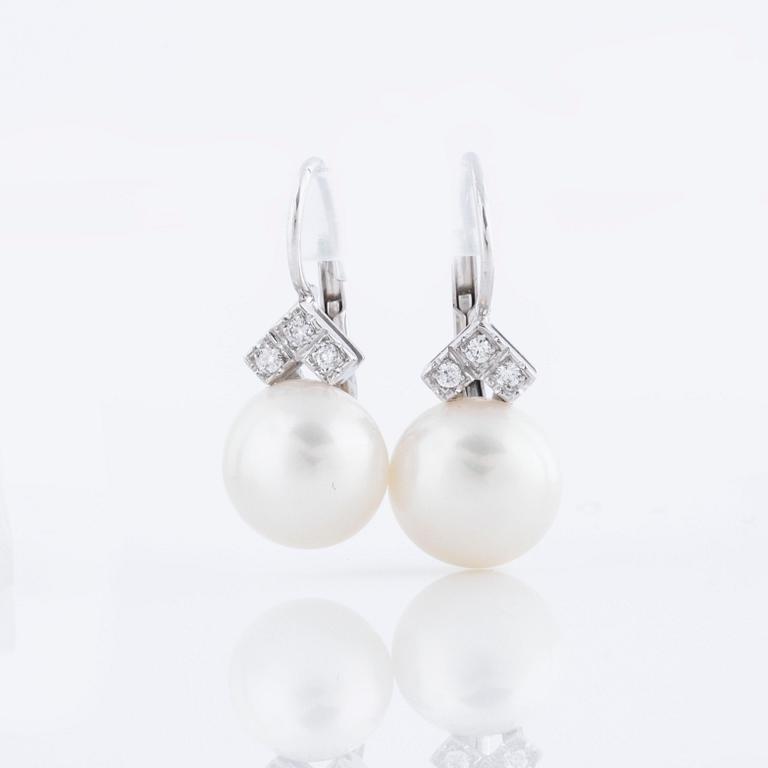 A pair of cultured pearl and ca 1.10 cts brilliant cut diamond earrings.