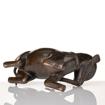 A bronze figure/censer of a reclining elephant, Qing dynasty, 19th Century.