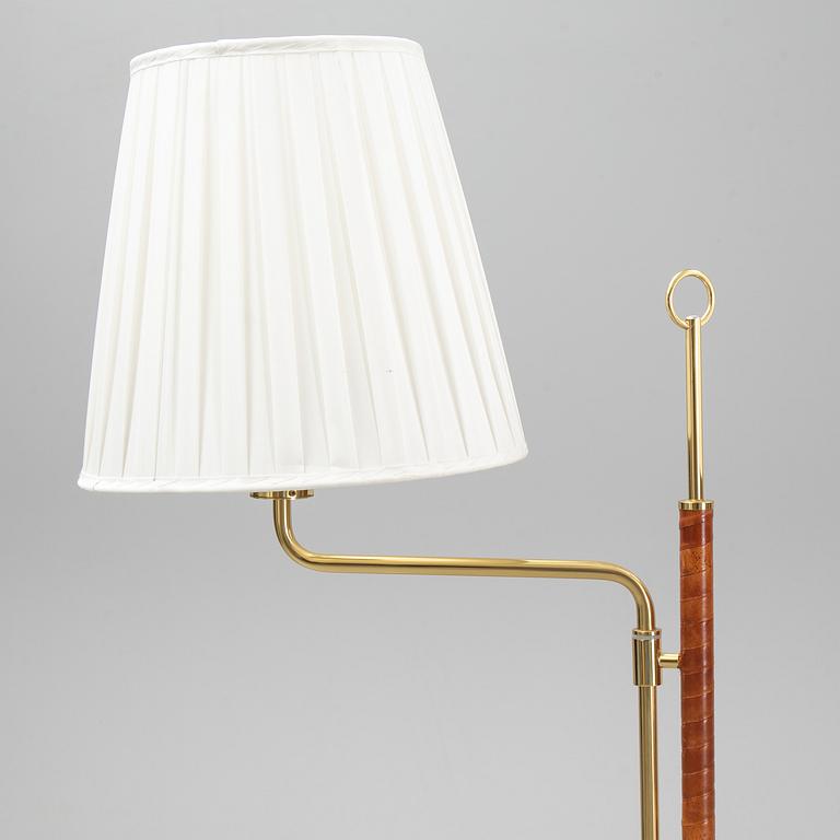 A pair of brass and leather floor lights, Örsjö Industri, 21st century.