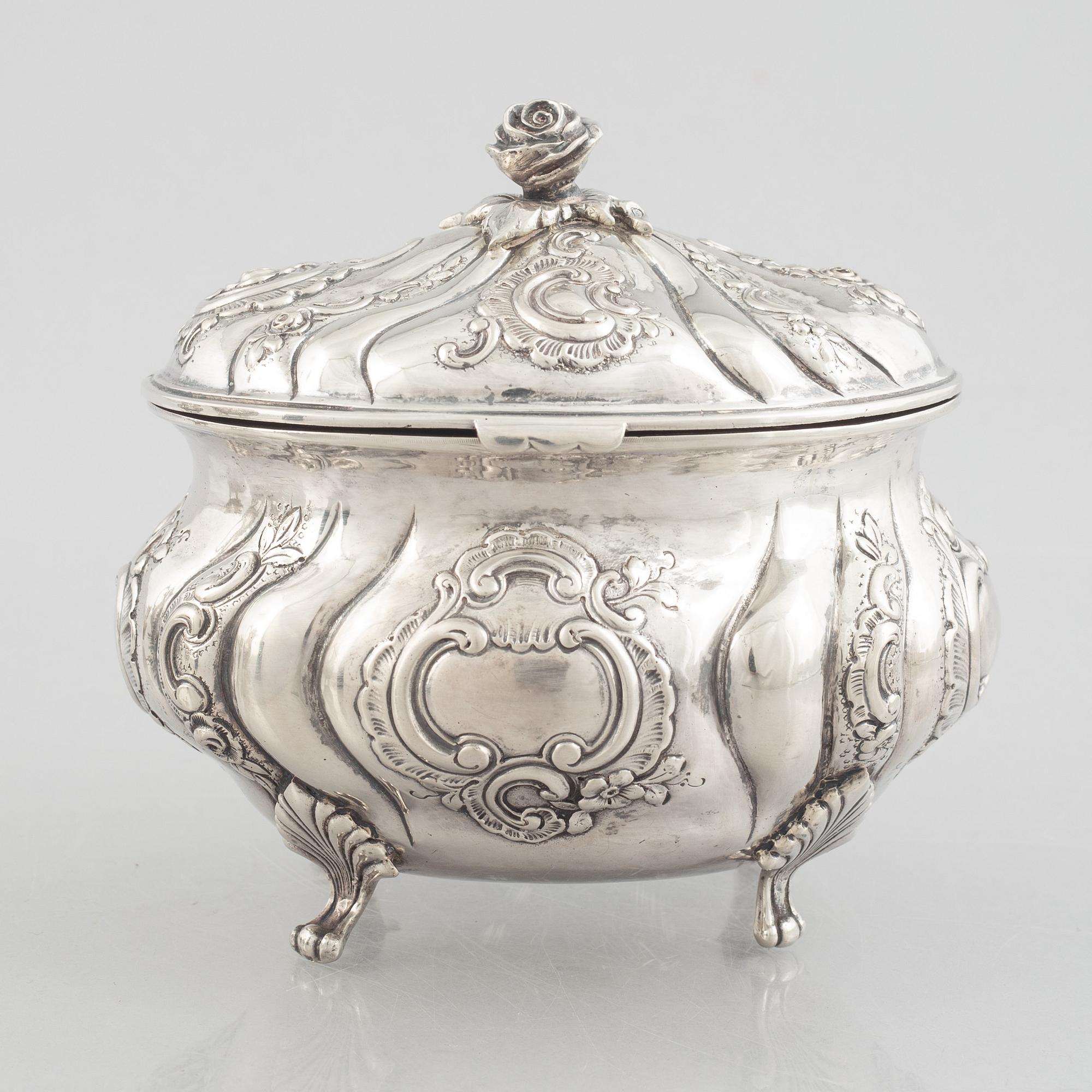 A Rococo-style silver coffee pot, creamer and sugar bowl, 20th Century.