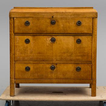 A mid 19th century chest of drawers veneered with birch.