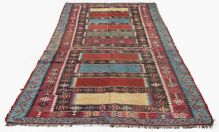 An antique Anatolian kilim, c. 374 x 148 cm.