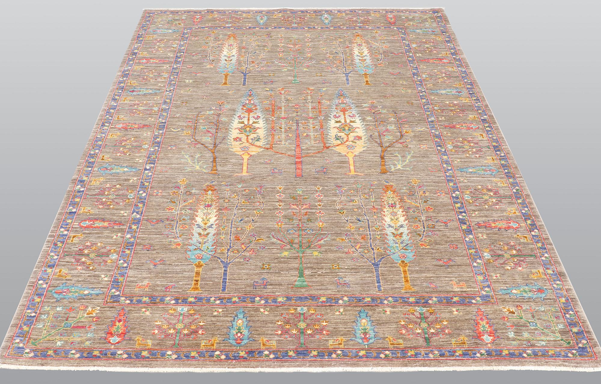 A rug, Ziegler design figural, ca 241 x 169 cm.