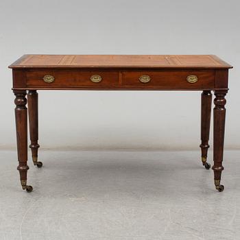 A late 19th century English writing table signed Holland & Sons.