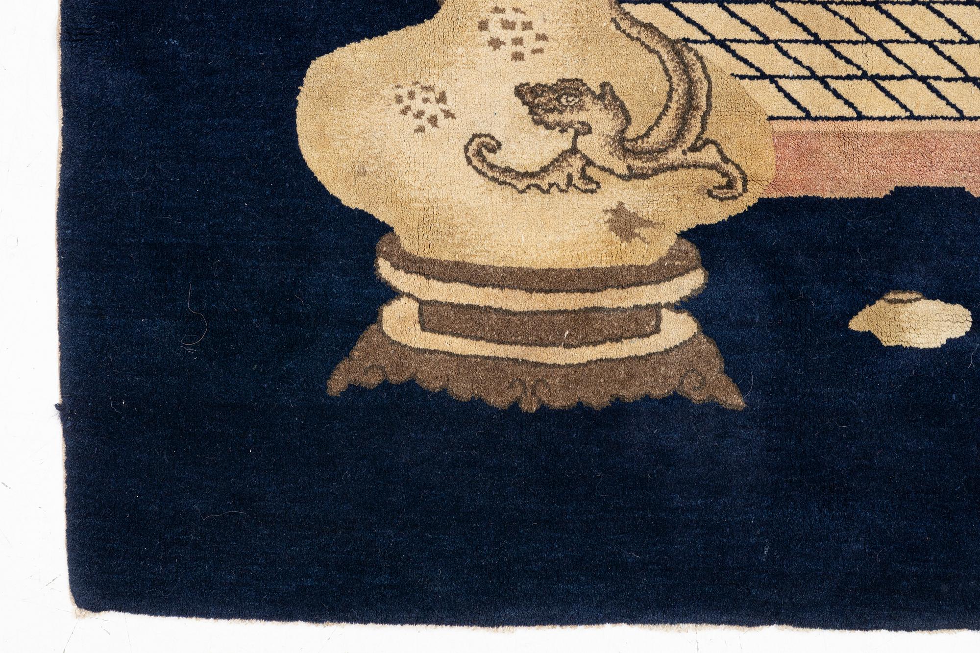 A semi-antique Baotou rug, approx. 185 x 122 cm.