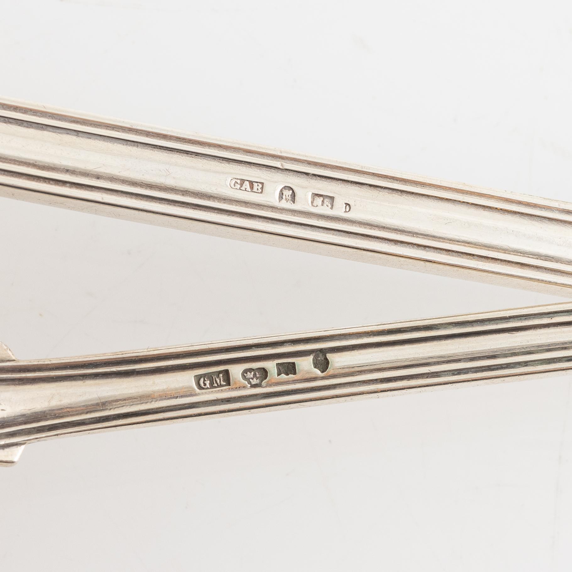 Two Swedish 19th century soup ladles, the small in silver, mark of Gustaf Möllenborg and the large in silver plate.