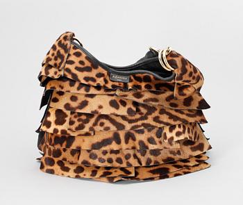 A leopard patterned pony skin handbag by Yves Saint Laurent.