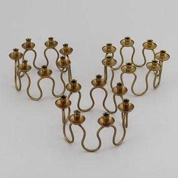 LARS HOLMSTRÖM, Three brass candelabra, Arvika, mid 20th Century.