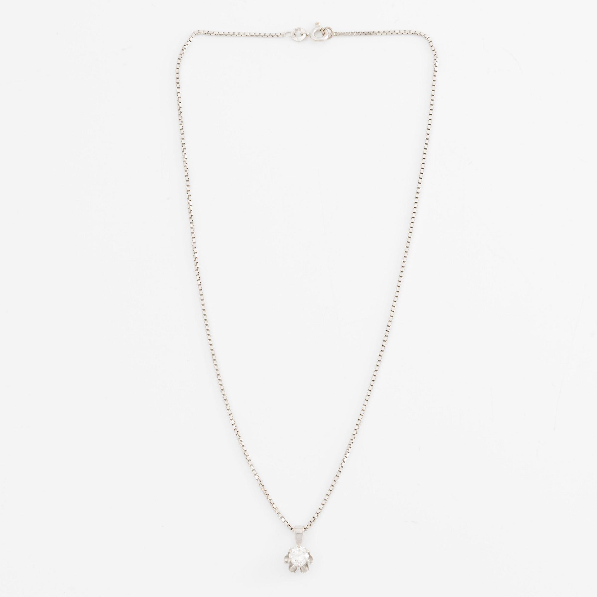 Pendant with chain in 18K gold and a round brilliant-cut diamond.